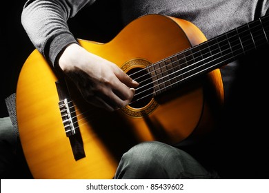 Acoustic Guitar Guitarist Playing Details. Musical Instrument With Performer Hands