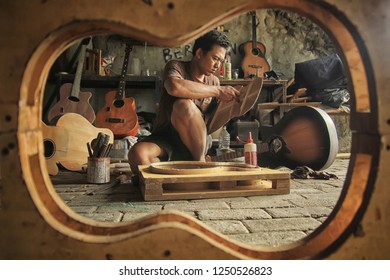 An Acoustic Guitar Maker Is Busy Working On His Order. Surabaya Indonesia 2017