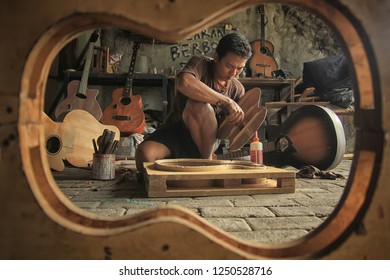 An Acoustic Guitar Maker Is Busy Working On His Order. Surabaya Indonesia  2017