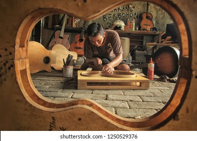 An Acoustic Guitar Maker Is Busy Working On His Order. Surabaya Indonesia  2017