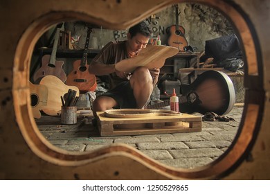 An Acoustic Guitar Maker Is Busy Working On His Order. Surabaya Indonesia  2017