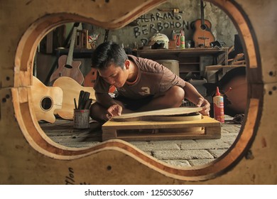 An Acoustic Guitar Maker Is Busy Working On His Order. Surabaya Indonesia  2017