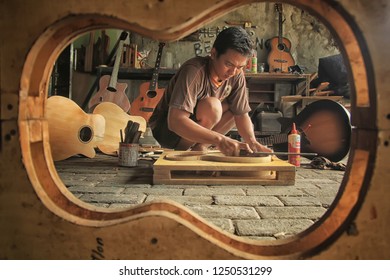 An Acoustic Guitar Maker Is Busy Working On His Order. Surabaya Indonesia  2017