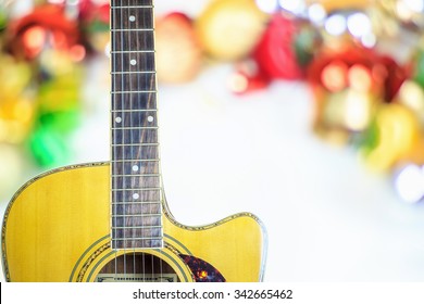 Acoustic Guitar On Christmas Background With Copy Space