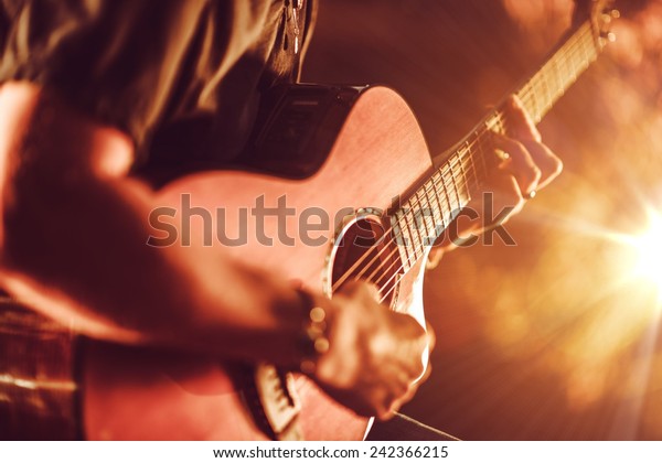 Acoustic Guitar Playing. Men Playing\
Acoustic Guitar Closeup\
Photography.