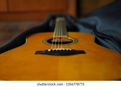 Acoustic Guitar In Soft Case.