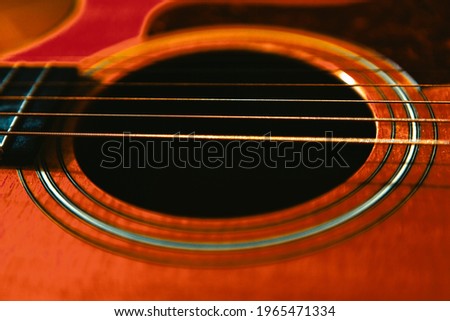 Acoustic Guitar Soundhole and Six Strings . Part of wooden guitar 