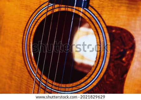 Acoustic guitar soundhole. Wooden strings musical instrument