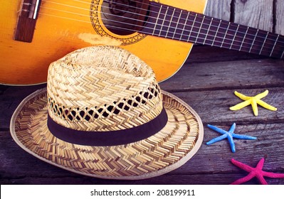 Acoustic guitar star hat and starfish on a grunge wood summer background  - Powered by Shutterstock