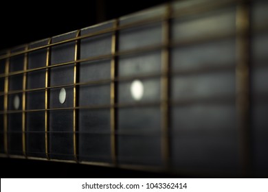 Acoustic guitar Strings on background guitar neck