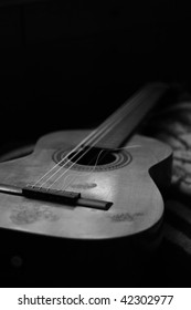 Acoustic Spanish Guitar With A Broken String.