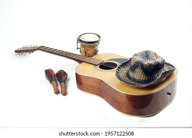 Acoustic twelve string guitar maracas bong hat isolated on white background