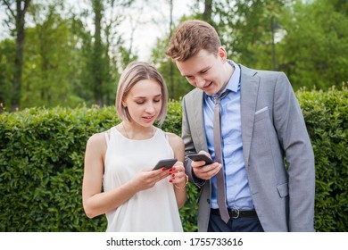 Acquaintanceship. Young woman and man giving cell phone numbers to each other - Shutterstock ID 1755733616
