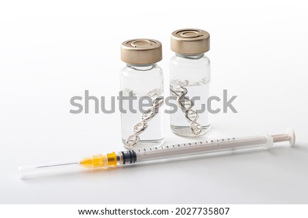 Acquired immunity vaccine, genetic pharmaceutical and immunization injection concept with glass vials contain DNA or mRNA double helix, hypodermic syringe and clear fluid isolated on white background