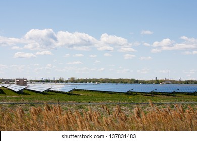 Acres Of Farmland Covered With Solar Panels, Produce Energy From The Sun At This Large Scale Solar Farm In Sarnia Ontario, Canada.