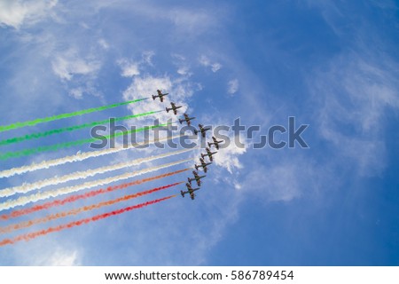 Acrobatic air performance of Frecce tricolori (tricolour arrows) in the sky