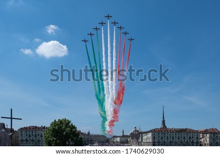 Acrobatic air performance of Tricolour arrows (Frecce tricolori) over Turin, Italy.