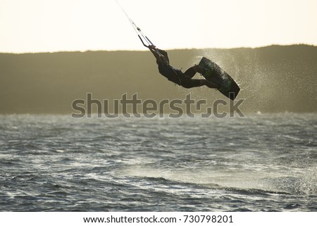 acrobatic jumping with kitesurfing
