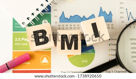Acronym BMI - Body Mass Index. Wooden small cubes with letters isolated on white background with copy space available. Concept image.