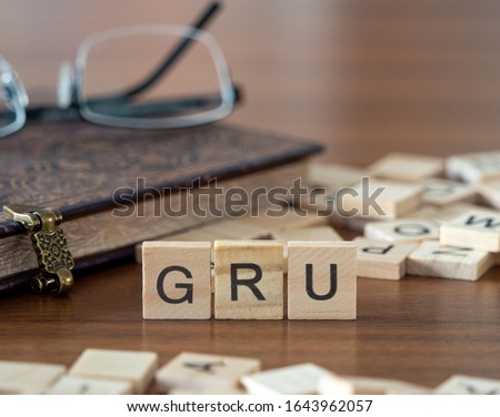 the acronym gru for Gated Recurrent Unit concept represented by wooden letter tiles