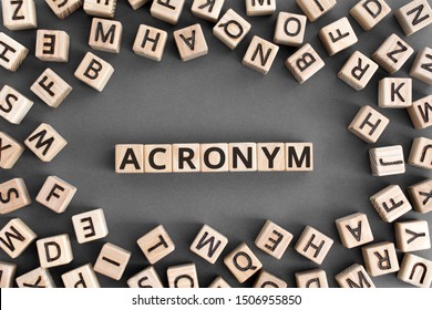 acronym - word from wooden blocks with letters, use of acronyms in the modern world abbreviation concept, random letters around, top view on wooden background - Shutterstock ID 1506955850