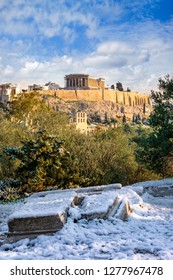 The Acropolis Of Athens Covered In Snow During A Sunny Winter Day, Greece