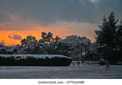 The Acropolis Of Athens, Covered In Snow, During Sunset. 