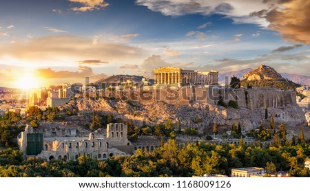 The Acropolis of Athens, Greece, with the Parthenon Temple on top of the hill during a summer sunset