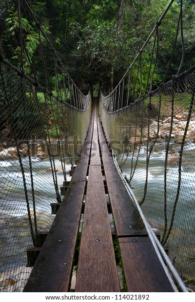 Across the\
suspension bridge\
waterfall,Thailand