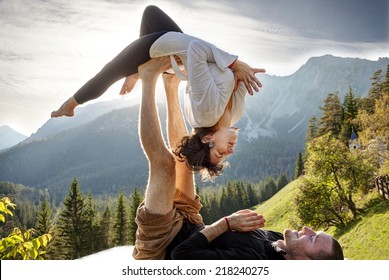 Acroyoga - Balancing on Feet - Powered by Shutterstock