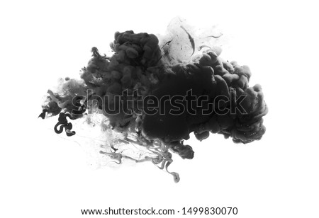 Acrylic black and white colors in water. Ink blot. Abstract background.