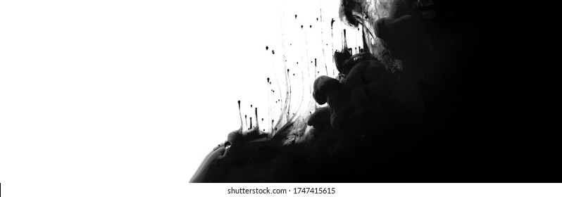 Acrylic colors flow in water. Black and white Abstract horizontal contrast background. 
