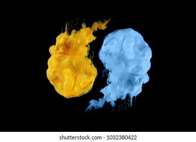 Acrylic colors in water. Ink blot. Abstract black background.  