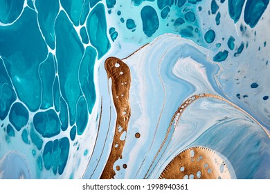 Acrylic Fluid Art. Liquid Gold On Blue Waves And Spots. Abstract Marble Background Or Texture