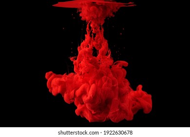 acrylic ink in water form an abstract smoke pattern isolated on black background