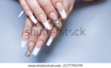 Acrylic nail extension. Manicure. Nail correction. Hands in the foreground. copy space.