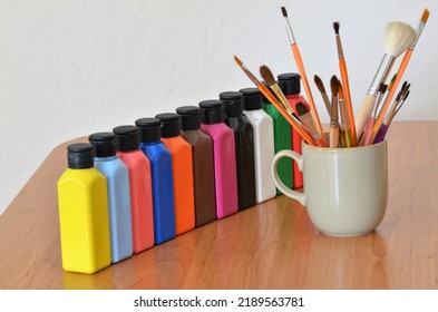 Acrylic Paint, Acrylic Paint Set On Wooden Table And Watercolor Brushes In Bowl. Back To School. Selective Focus.