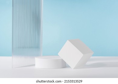 Acrylic ribbed plate, podium, background for cosmetic product packaging on blue backdrop. Showcase for jewellery presentation, display for perfume advertising, cosmetics branding scene mockup - Shutterstock ID 2153313529