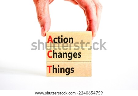 ACT action changes things symbol. Concept words ACT action changes things on wooden blocks on a beautiful white table white background. Business and ACT action changes things concept. Copy space.