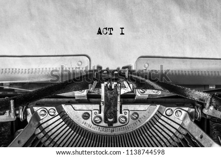ACT I, typed text on a vintage typewriter, screenplay title heading. On old paper with ink. writer's idea