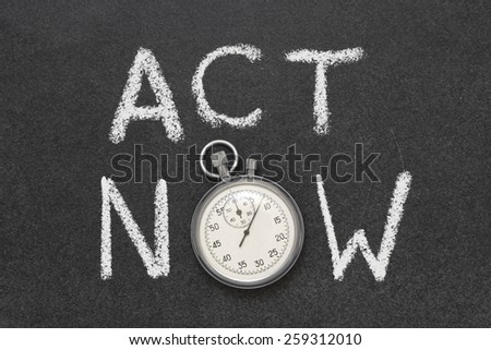 act now phrase handwritten on chalkboard with vintage precise stopwatch used instead of O 