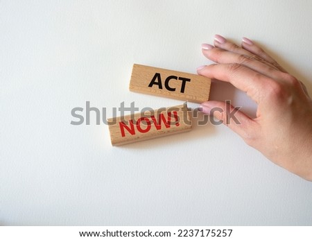 Act now symbol. Wooden blocks with words Act now. Beautiful white background. Businessman hand. Business and Act now concept. Copy space.