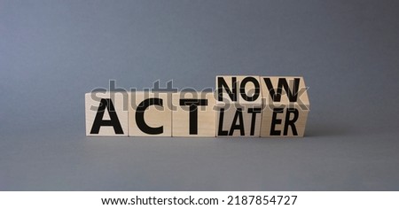 Act Now vs Act Later symbol. Turned cubes with words Act Now vs Act Later. Beautiful grey background. Business concept. Copy space