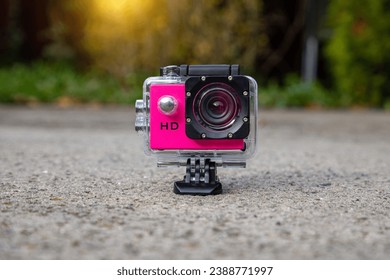 Action camera in a protective box for shooting dynamic videos.
