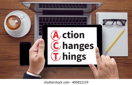Action Changes Things (ACT) , on the tablet pc screen held by businessman hands - online, top view