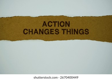 Action Changes Things text on paper craft with white paper torn ripped of horizontal