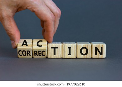 Action or correction symbol. Businessman turns wooden cubes and changes the word correction to action. Beautiful grey background, copy space. Business and action or correction concept.
