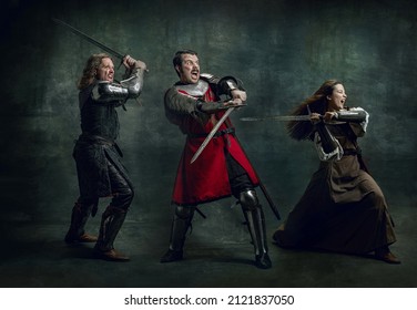 In action. Creative art collage with brutal serious medieval warriors or knights war clothes with wounded faces holding shield, sword isolated over vintage background. Comparison of eras, history