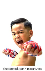 Action face little boy with boxing bandage - Thai flag color as Muay thai boxer . Portrait of a sporty child engaged in boxing on white background.