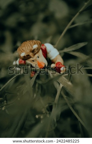 action figure toy climbing a tree seen from above